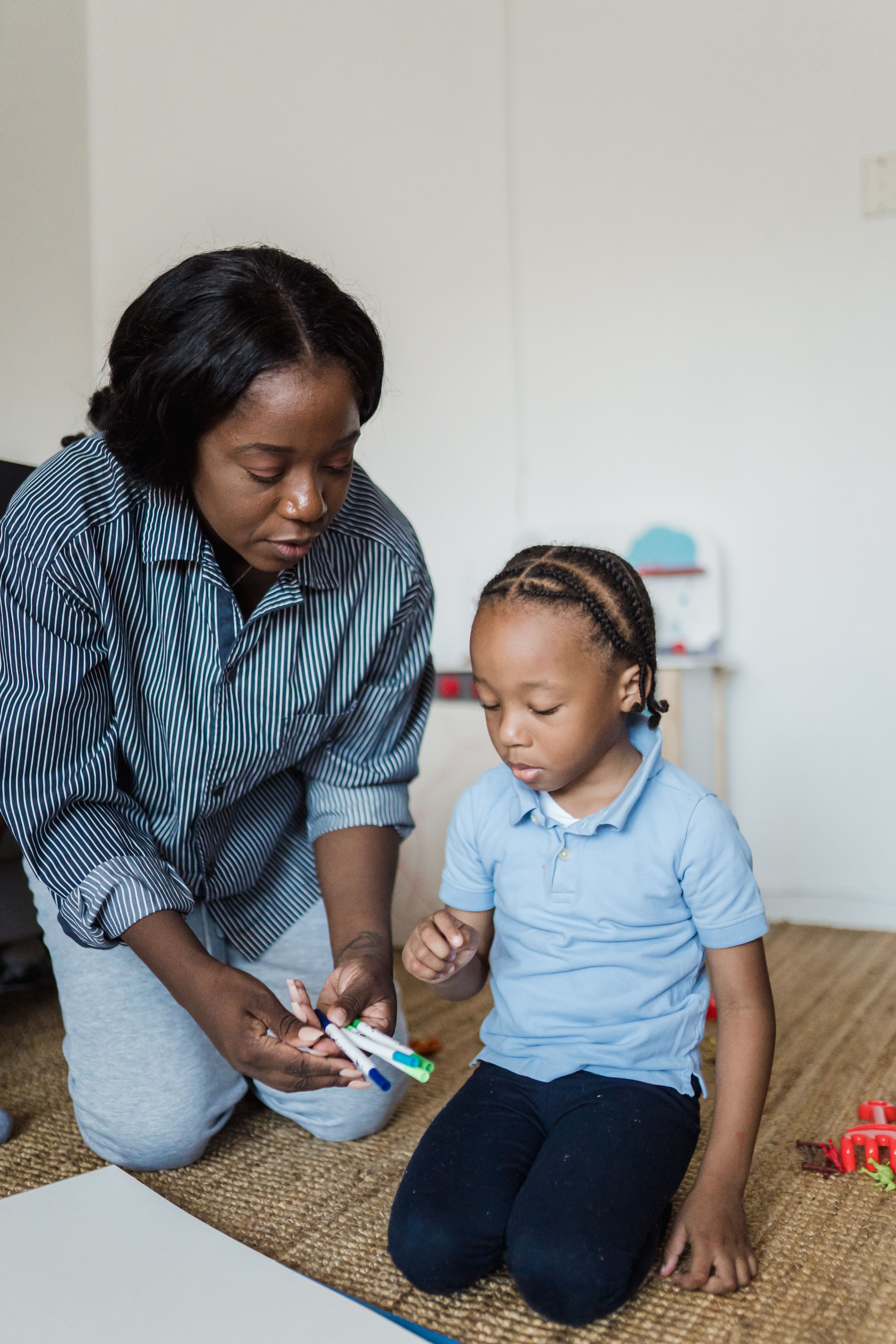 Practitioner working one-to-one with a child in a supervised session